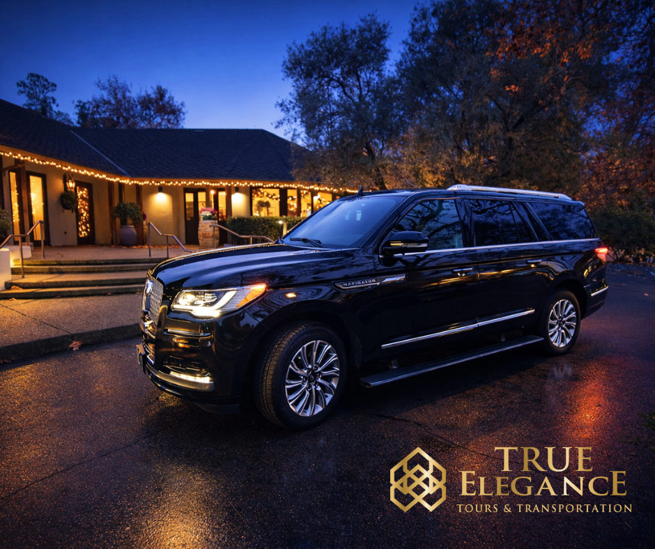 Black luxury SUV outside an illuminated Napa Valley property at dusk